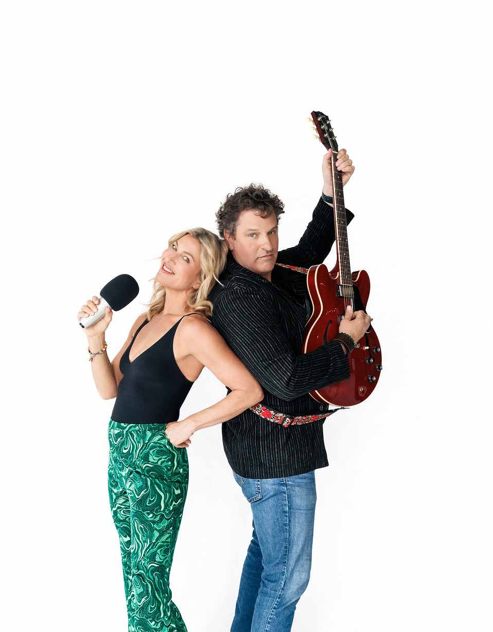 Stephanie Florian and Gord Kushner back-to-back with microphone and guitar